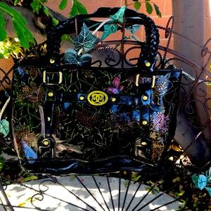 Purse with mini purse and makeup bag inside.